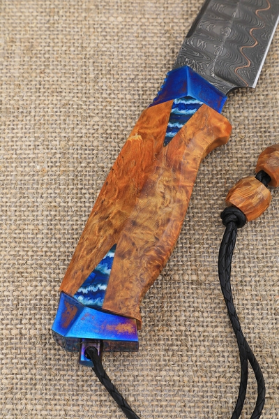 Knife Eagle Damascus laminated handle and scabbard Karelian birch amber on a stand