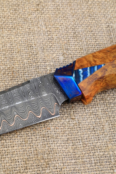 Knife Eagle Damascus laminated handle and scabbard Karelian birch amber on a stand