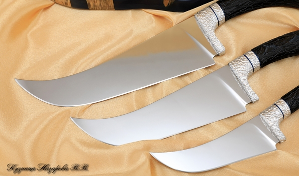 A set of Uzbek knives 95h18 black hornbeam on a stand